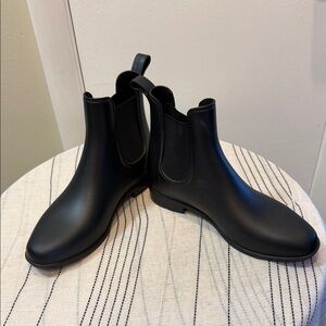 A new day black rain boots